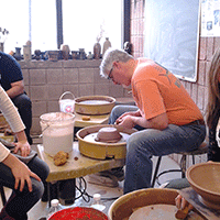 volunteers at Manchester Craftsmans Guild make bowls for Empty Bowls