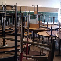 Stacked furniture in closed school | WBEZ/Linda Lutton