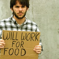 Man with "will work for food" sign