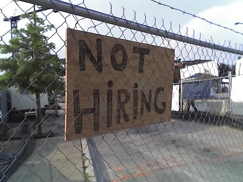 not hiring sign on fence
