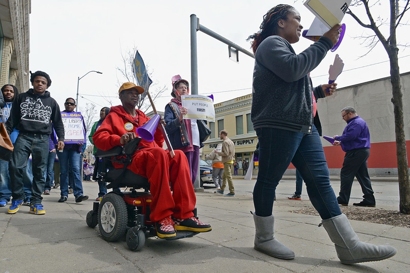 Just Harvest, SEIU, and Action United protest the closing of the East Liberty state Dept of Public Welfare office in East Liberty, 04/01/14 | Bob Donaldson, Pittsburgh Post-Gazette