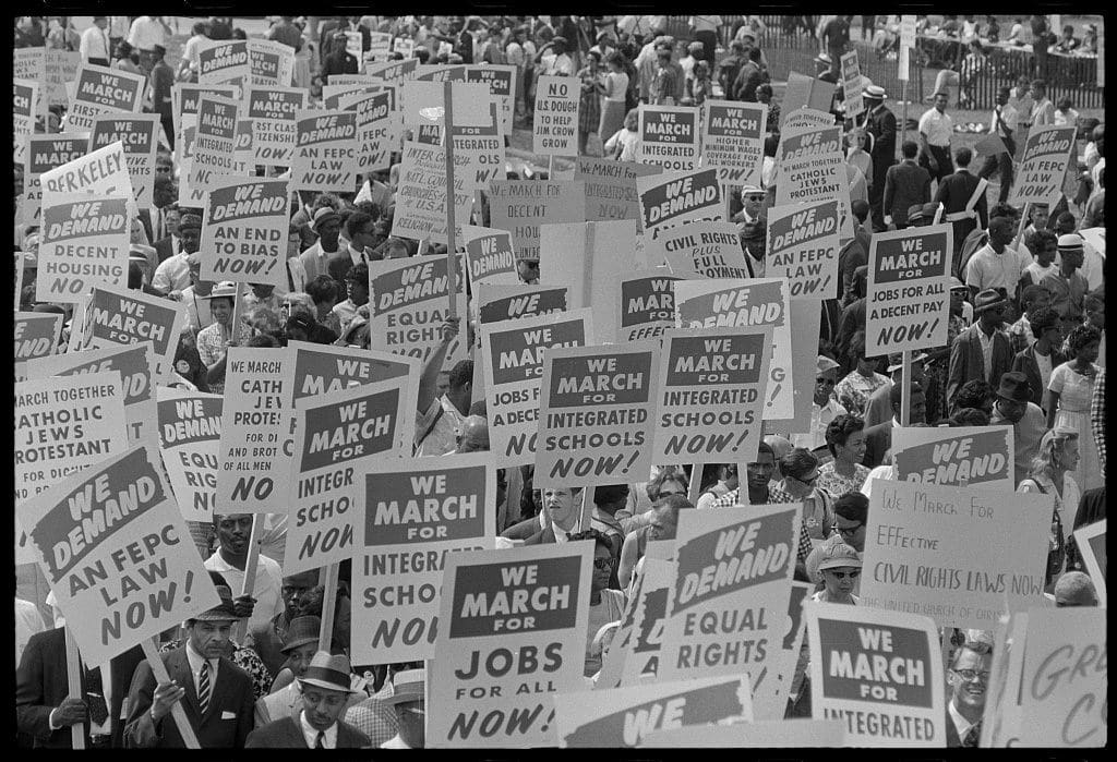 Signs carried by many marchers, during the March on Washington for Jobs and Freedom, 1963 (Wikimedia Commons)