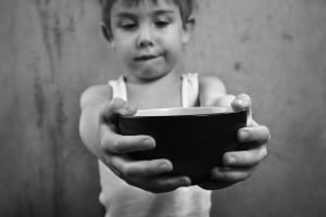boy holding empty bowl