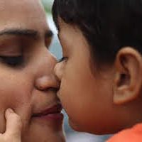 Immigrant mother and child embrace