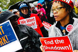 Government shutdown protesters with signs saying "We Want to Work!" and "End the Shutdown"