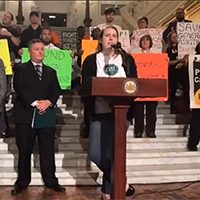 Our policy advocate Ann Sanders speaks at a June 2019 rally in Harrisburg to save General Assistance