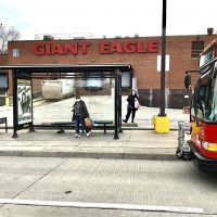 Port Authority bus at stop in front of Giant Eagle grocery store